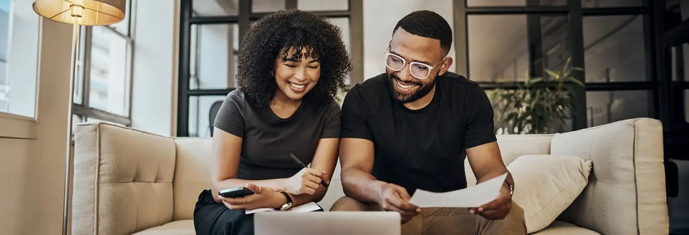 Buy and Borrow banner image with couple on laptop