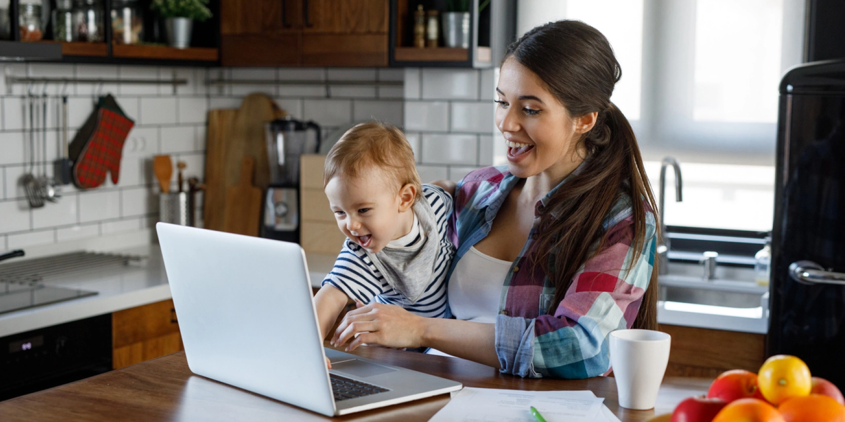 Woman and child using laptop