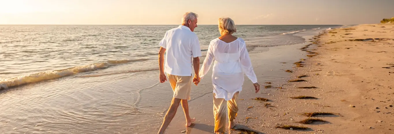Plan and Retire Article banner with older couple on beach